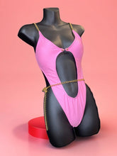 Alter Ego stylish cut-out pink swimsuit with adjustable waist chain.