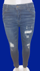 Stretched ripped jean pants with well-worn details.