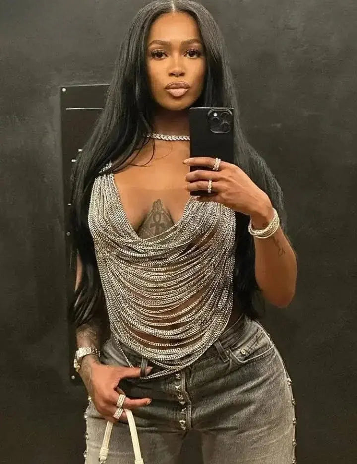 Woman wearing stylish Fashion Body Jewelry and taking a mirror selfie.