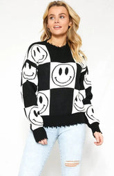 Happy Smiley Face Sweater with checker box design and smiley faces, cozy and stylish for all seasons.