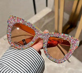 Colorful cat-eye sunglasses with sparkling frames, known as Bling Bling Shades.