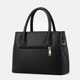 Black Women's Handbag with Gold-Tone Hardware, Spacious and Stylish Design.