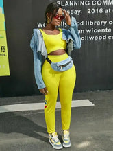 Stretchy yellow letter print leggings with denim jacket and matching crop top.