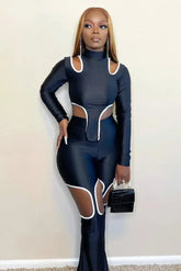Diva's Cut Out Set - Stylish black outfit with white trim for a bold look.