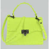 Bright yellow crossbody statement handbag with stud details.