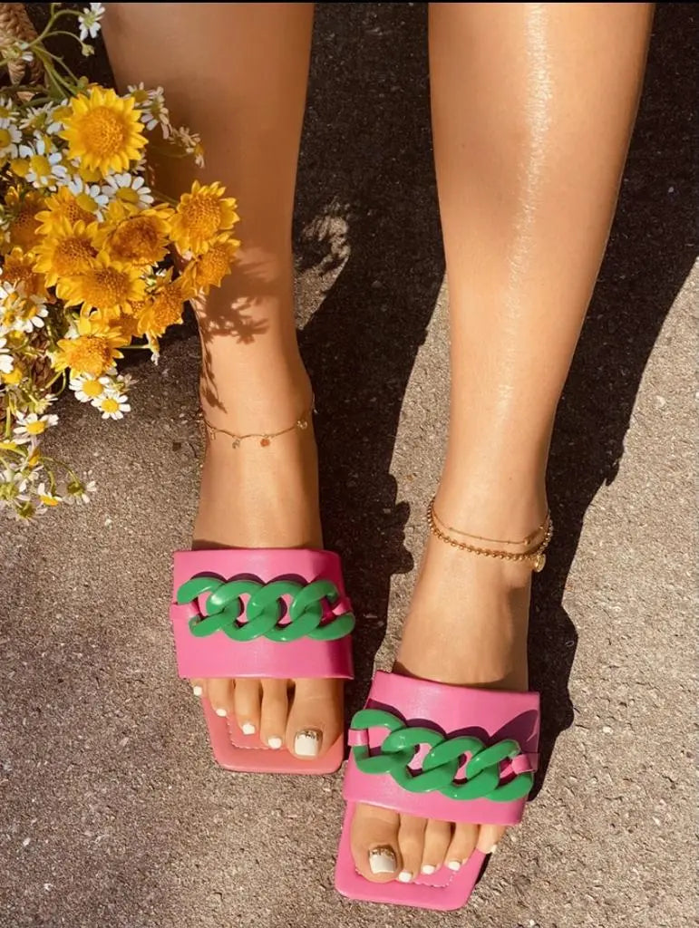 Chic Couture Sandals with open toe and chain link design.