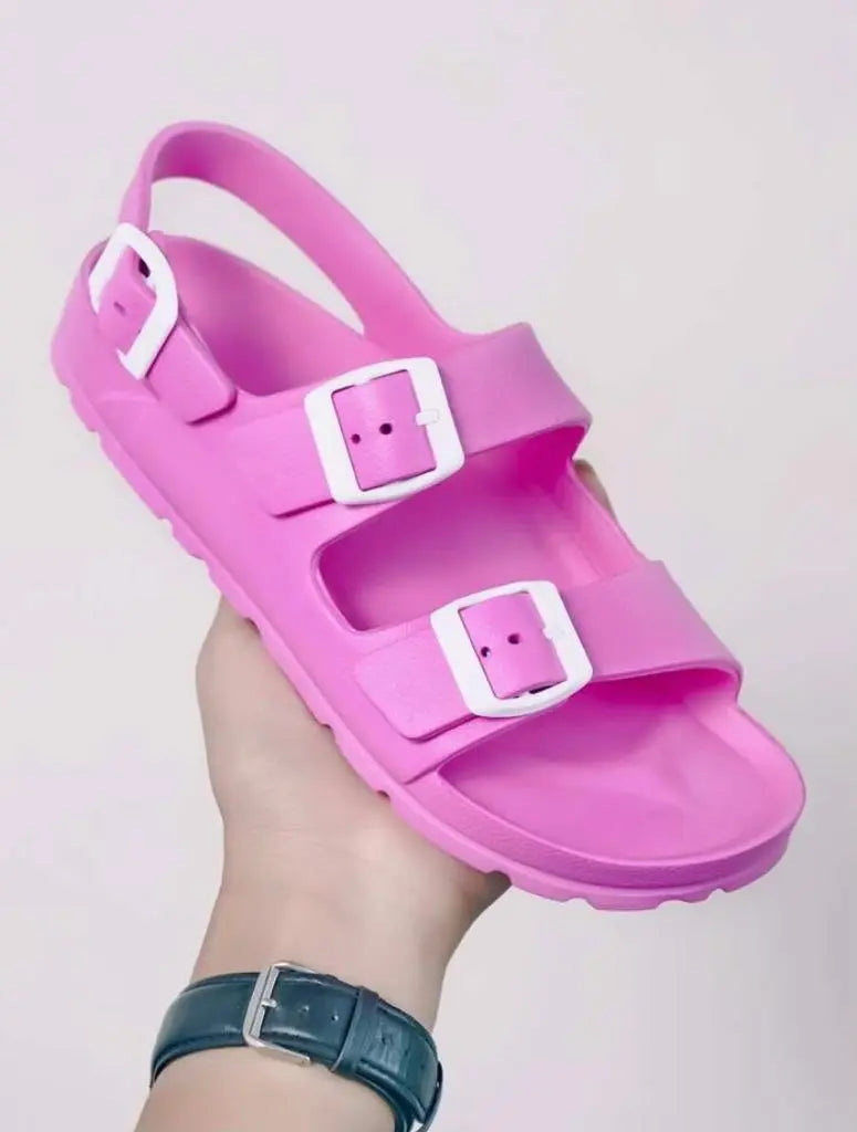 Pink double buckle sandals with adjustable back strap.