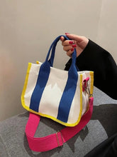 Multicolor Living Color Canvas Bag with shoulder and crossbody options.