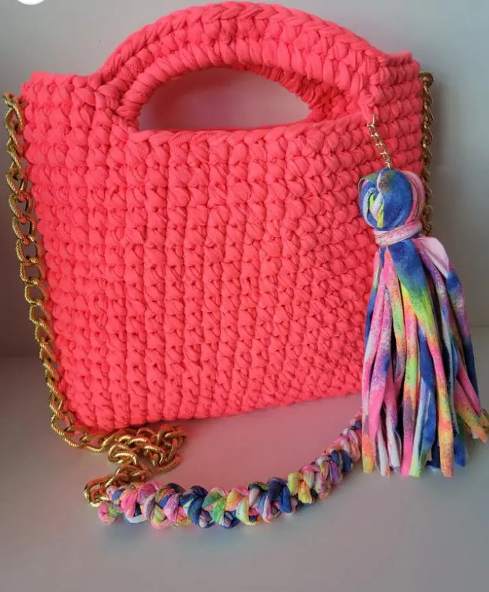 Social Butterfly Handmade Crochet Handbag with colorful crossbody strap and tassel.