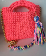 Social Butterfly Handmade Crochet Handbag with colorful crossbody strap and tassel.