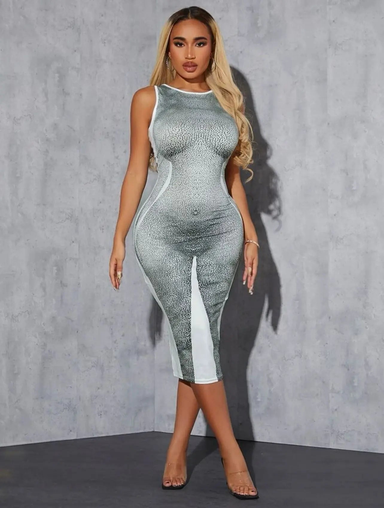 Trendy bodycon sleeveless boo dress with silhouette design.