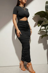 Stylish black bodycon maxi-dress with cut-out design.