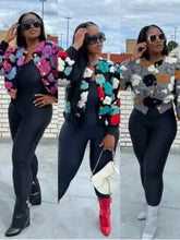 Trendy plush floral print cardigan sweater with long sleeves and button-down style.