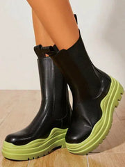 Black women's trendy booties with green soles, size 8.