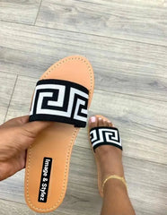 Stylish flat slip-on elastic sandal for women.