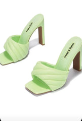 Stylish green mule heels with padded insole for comfort.