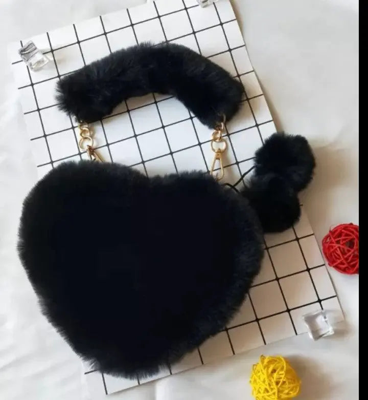 Image & Stylez LLCLove Fuzzy Heart HandbagColor My Love Fuzzy Heart HandbagThis stylish plush handbag is designed with fluffy fur outside. It has a fuzzy top handle and one golden chain shoulder strap that is removable. There are 3 differen