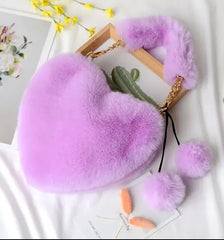 Image & Stylez LLCLove Fuzzy Heart HandbagColor My Love Fuzzy Heart HandbagThis stylish plush handbag is designed with fluffy fur outside. It has a fuzzy top handle and one golden chain shoulder strap that is removable. There are 3 differen