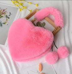 Image & Stylez LLCLove Fuzzy Heart HandbagColor My Love Fuzzy Heart HandbagThis stylish plush handbag is designed with fluffy fur outside. It has a fuzzy top handle and one golden chain shoulder strap that is removable. There are 3 differen