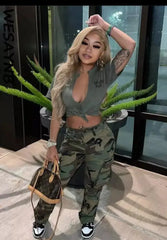Women wearing camo cargo pants standing outdoors.