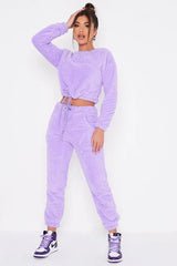 Cozy drawstring jogger set in soft purple fabric with trendy design.