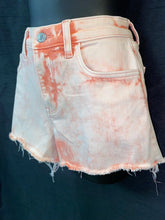 Tie-dye shorts with unique design and frayed edges, trendy and versatile.