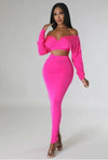 Trendy pink maxi skirt set with crop top featuring sleek design.