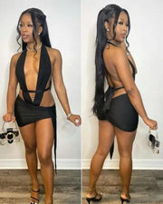 Trendy black 2pc set with backless halter and ruched knot mini skirt.