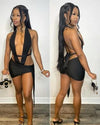 Trendy black 2pc set with backless halter and ruched knot mini skirt.