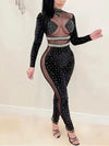 Elegant Top Gyal Jumpsuit with bling details and mesh cut-out design.