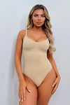 Seamless women's shapewear bodysuit in beige, comfortable design.