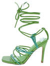 Green strappy Mystique Heels with high heel design.